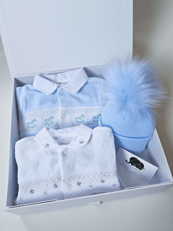 Baby Boy Delux Velour Gift Box: Featuring a Rocking Horse Velour Sleepsuit, Starry Night Velour Sleepsuit, a cosy Pom Pom hat, and a sweet 'New Baby' card,. This cute gift set is perfect for welcoming a baby boy into the world.
