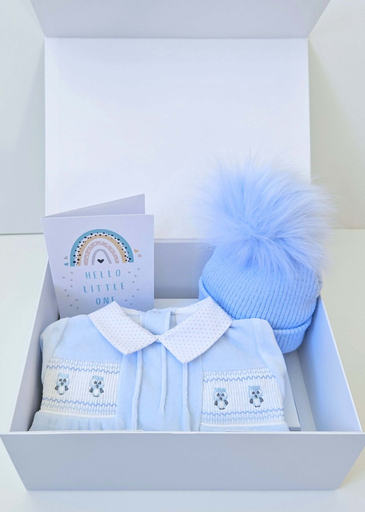 Baby Boy Velour Gift Box: Featuring an Owl Velour sleepsuit, a cosy Pom Pom hat, and a sweet 'New Baby' card, this luxurious gift set is perfect for welcoming a baby boy into the world.