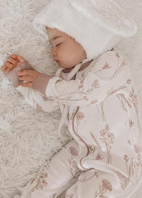 Sleeping baby wearing Wildflower Zip Sleepsuit