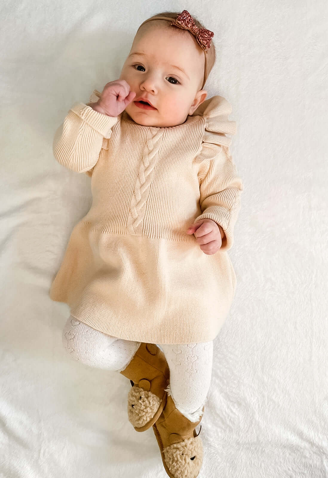 Beautiful Beige Flutter Sleeve Knitted Dress: Made from soft knit, beautiful frill detail on shoulders. Perfect for any occasion, this dress offers both style and comfort for your baby girl