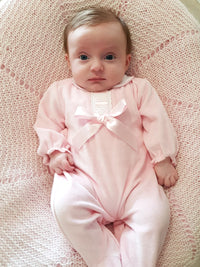 Baby Wearing Pink Velour Bow and Lace Sleepsuit