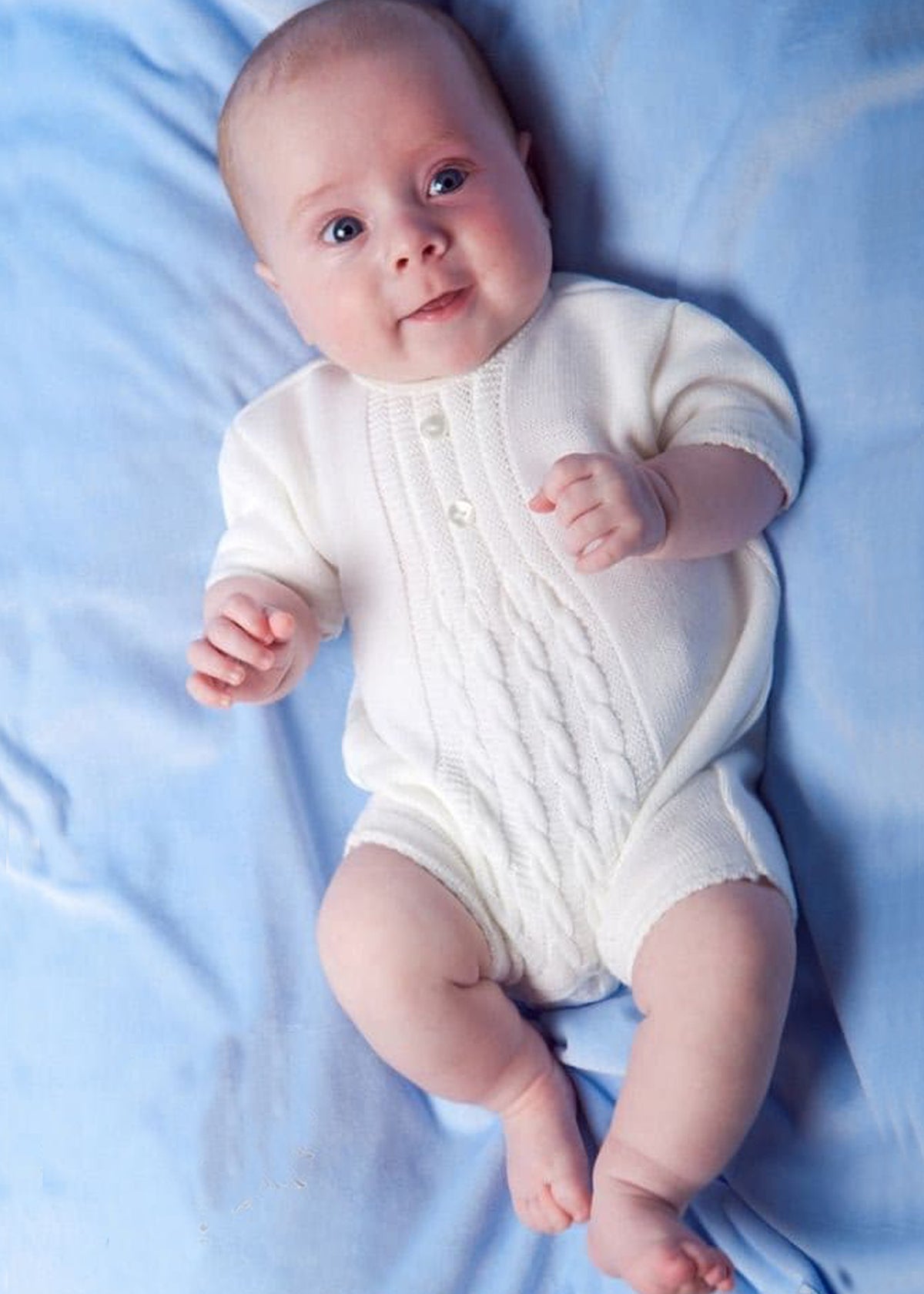 Baby wearing Dandelion White Cable knitted Romper