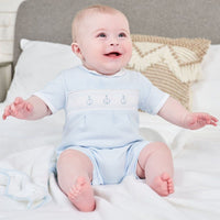 Happy baby wearing Dandelion Romper