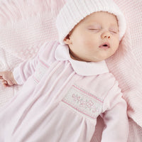 Sleeping baby wearing Dandelion Pink Flower Velour Sleepsuit 